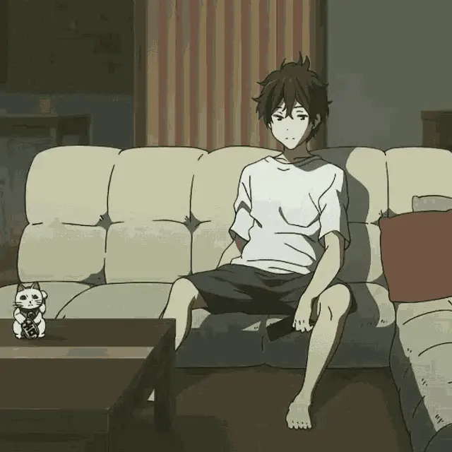 Pengalaman Menonton yang Nyaman Seseorang yang nyaman menonton anime di sofa